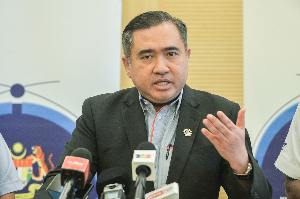 Minister of Transport, Anthony Loke witnessing the Interim Stage Bus Support Fund signing ceremony in Putrajaya on April 13, 2023. — Picture by Miera Zulyana