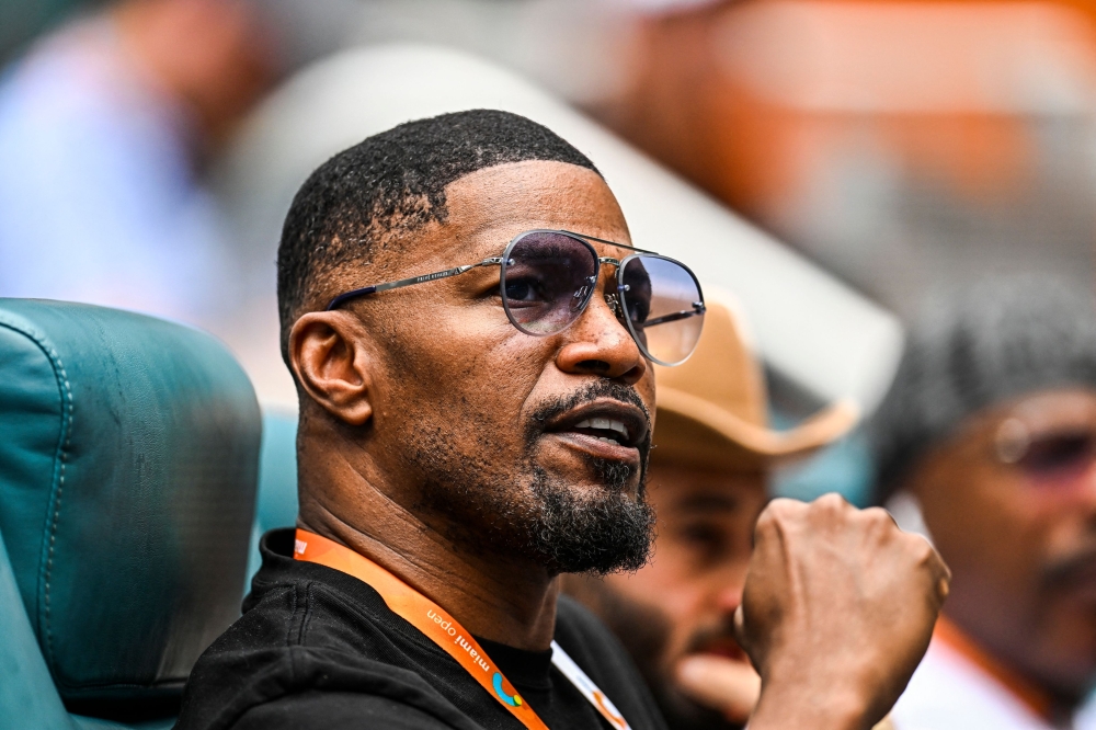 US actor Jamie Foxx attends the men's quarter-final match between Christopher Eubanks and Daniil Medvedev at the 2023 Miami Open at Hard Rock Stadium in Miami Gardens, Florida March 30, 2023. Foxx has been hospitalised with an unspecified medical complication but is in recovery, his family says on April 13, 2023. — AFP