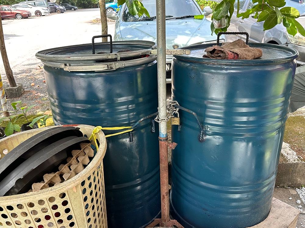 Bucking traidition, they slow cook the 'lemang' in these customised stainless steel containers.