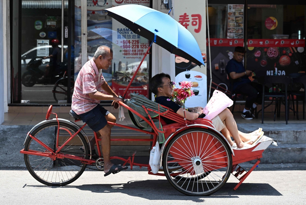 There are just over 130 trishaws in Penang, where they differ in style from the few dozen found in the southern state of Malacca, where the vehicles remain popular among tourists. — AFP pic