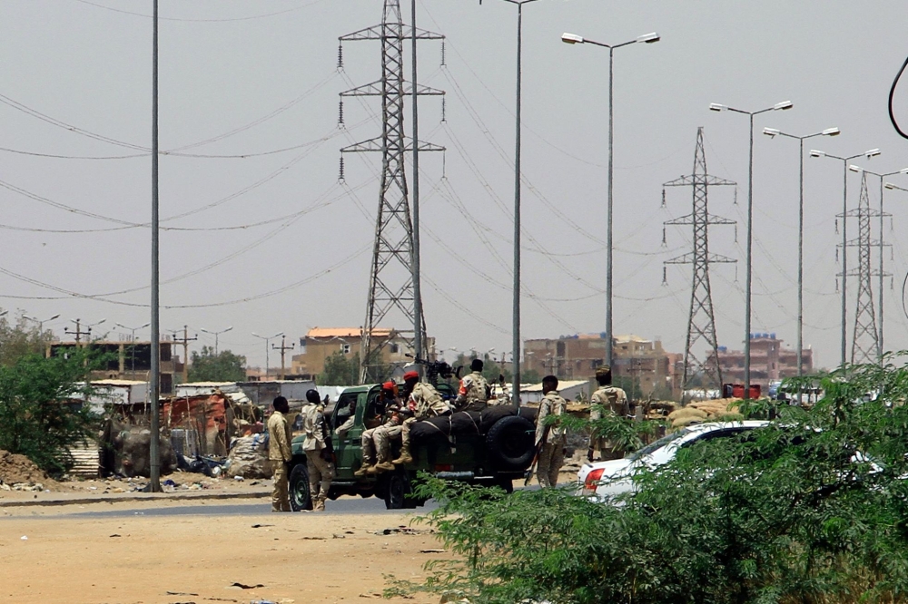 Army soldiers deploy in Khartoum on April 15, 2023, amid reported clashes in the city. — AFP pic