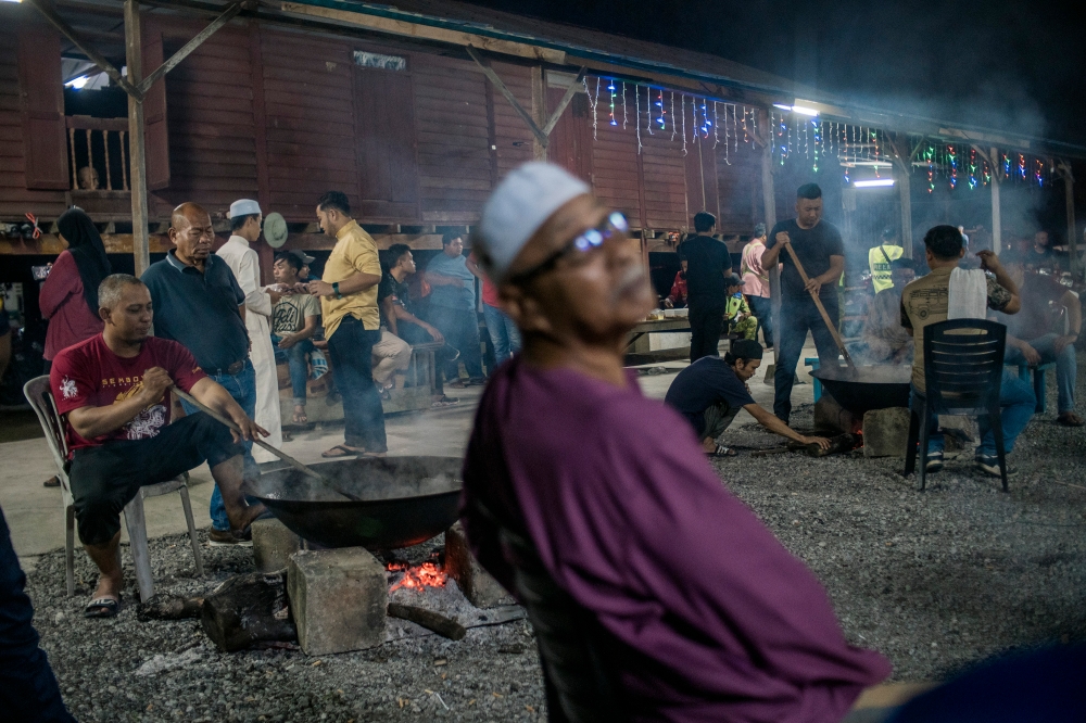 Making dodol is such a tedious process that fewer people want to take part in making it. — Picture by Shafwan Zaidon