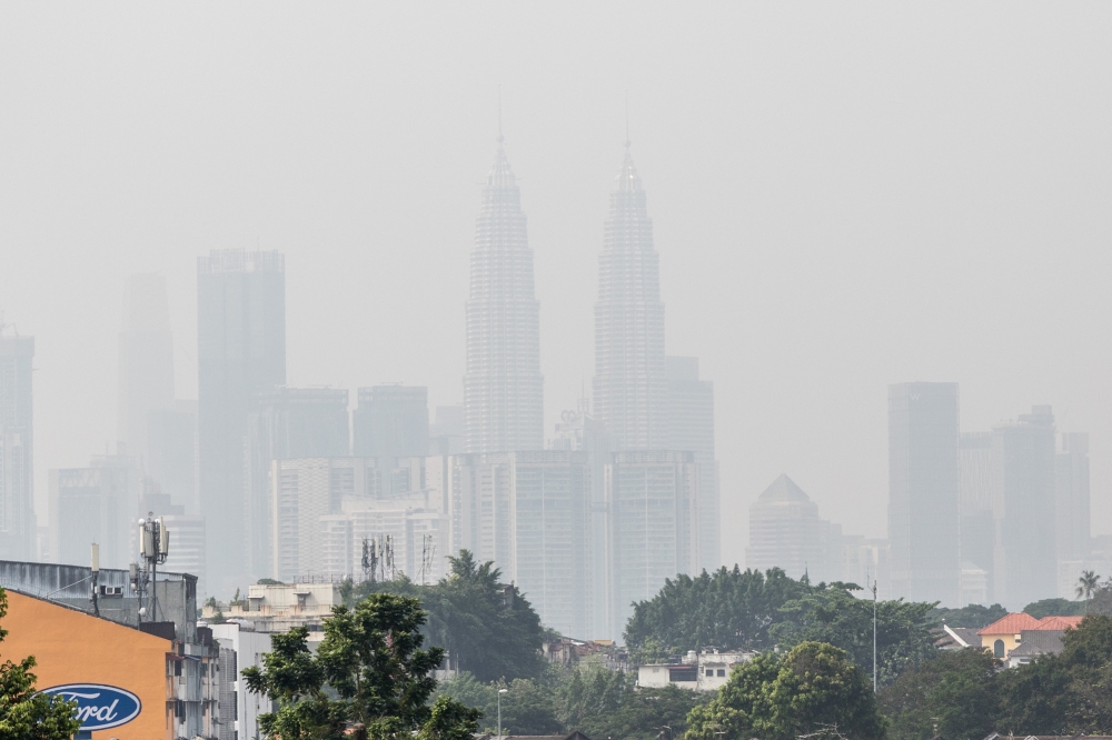 Petronas Twin Towers are seen shrouded in haze in Kuala Lumpur April 17, 2023. — Picture by Firdaus Latif