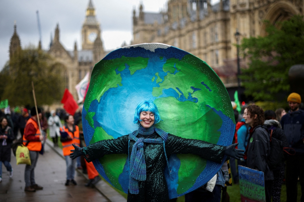 A demonstrator during the Extinction Rebellion’s ‘The Big One’ event, in London. — Reuters pic