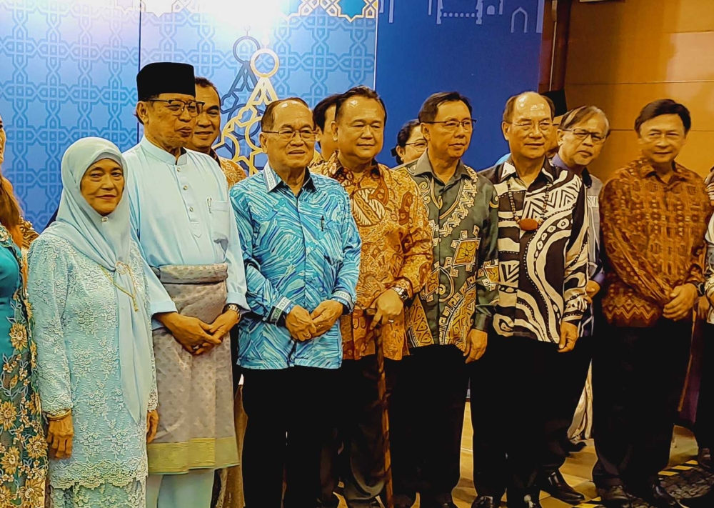 Premier Tan Sri Abang Johari Openg (second from left) and Deputy Premier Datuk Amar Douglas Uggah (third from left) at the Sarawak Premier Hari Raya open house, April 22, 2023. — Picture by Sulok Tawie