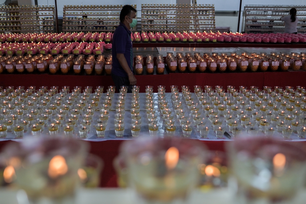 A Buddhist devotee is seen at the Buddhist Maha Vihara temple, Brickfields on Wesak day May 15, 2022. — Picture by Miera Zulyana