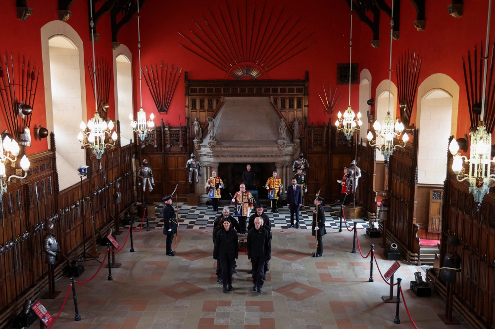 The Stone of Destiny is carried out of the Great Hall in Edinburgh Castle on April 27, 2023 during a special ceremony before being transported to Westminster Abbey for the Coronation of Britain's King Charles III. — Russell Cheyne/Pool /AFP pic