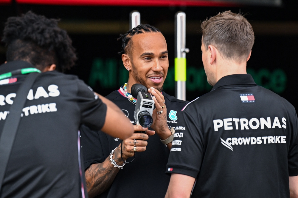 Mercedes’ British driver Lewis Hamilton uses a camera at his team’s garage at the Baku City Circuit ahead of the Formula One Azerbaijan Grand Prix in Baku on April 27, 2023. ― AFP pic