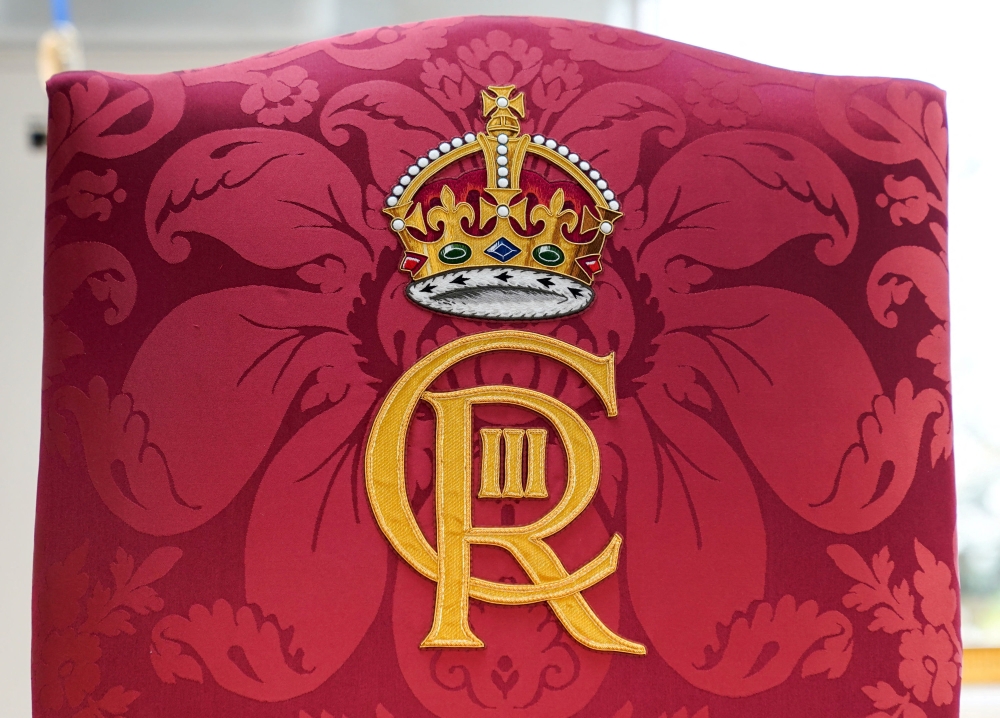 A detailed view of the Royal cypher on the Chair of Estate for King Charles at the Frogmore Conservation Workshops, ahead of the Coronation of King Charles and Camilla, Queen Consort on May 6., in Windsor, Berkshire April 21, 2023. — Andrew Matthews/Pool/Reuters pic