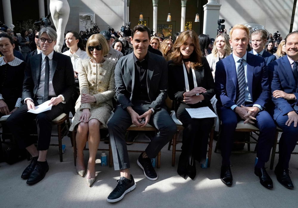 English magazine editor Anna Wintour, Swiss tennis player Roger Federer, and French singer and model Carla Bruni attend the press preview of The Costume Institute's exhibition titled ‘Karl Lagerfeld: A Line of Beauty’, at The Metropolitan Museum of Art in New York May 1, 2023. — AFP pic