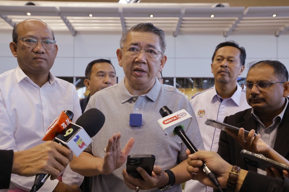 Domestic Trade and Cost of Living Minister Datuk Seri Salahuddin Ayub speaks to reporters at the Kuala Lumpur International Airport in Sepang May 2, 2023. — Bernama pic