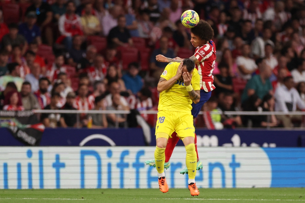 Atletico overtake Real Madrid with Cadiz rout