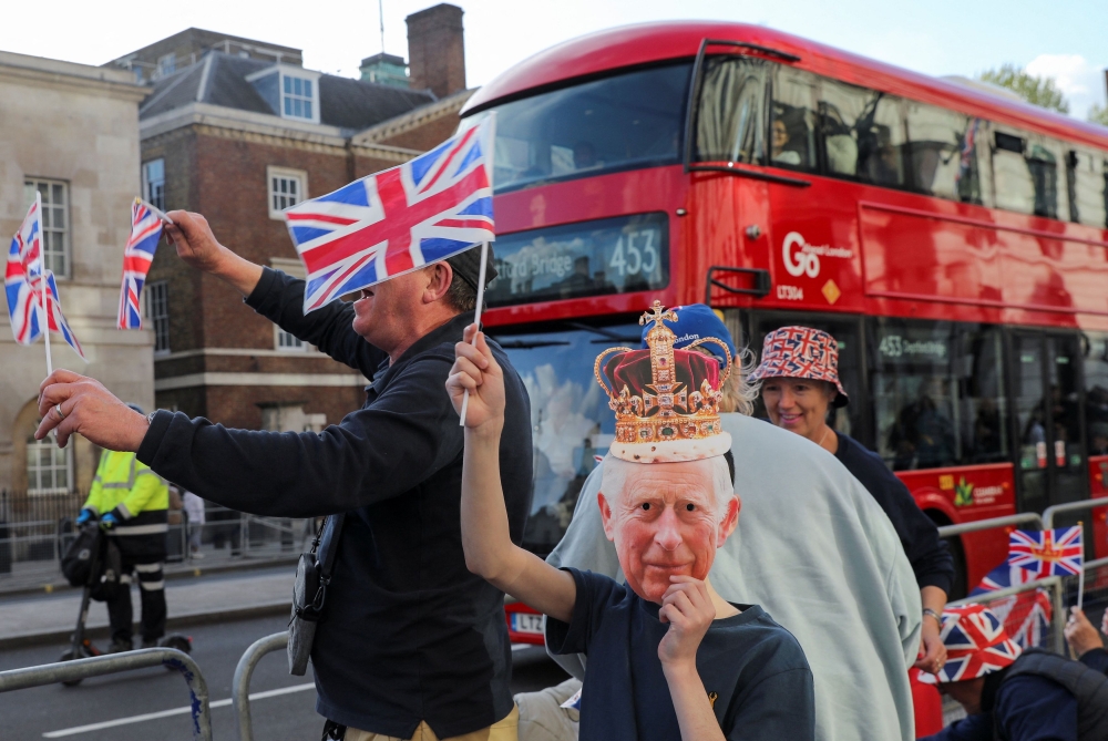 Well-wishers gather along the path that Britain's King Charles and Queen Consort Camilla will travel during the procession marking their coronation along the main streets of London, Britain May 5, 2023. ― Reuters pic