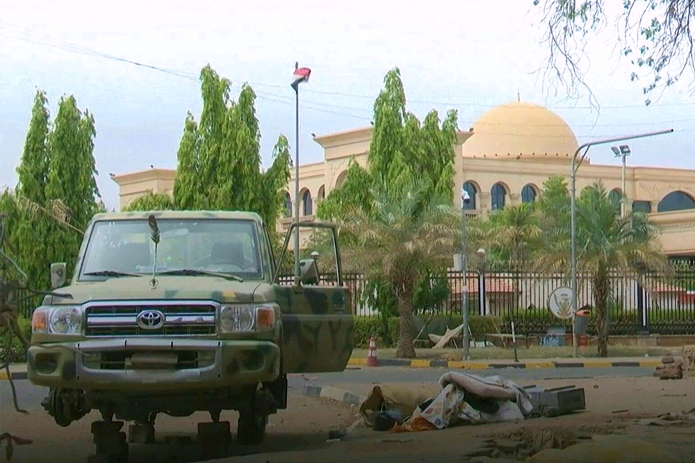 In this image grab taken from footage released by the Sudanese paramilitary Rapid Support Forces (RSF) on May 1, 2023, a half dismantled vehicle sits across the compound of the presidential palace in Khartoum. — AFP pic