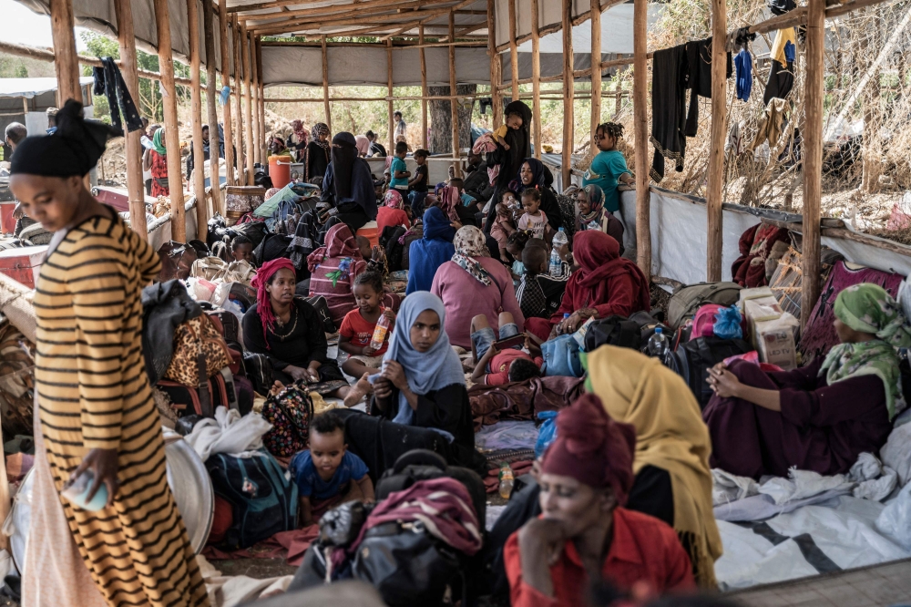 Refugees from Sudan take shelter in Metema, Ethiopia on May 4, 2023. More than 15,000 people have fled Sudan via Metema since fighting broke out in Khartoum in mid-April, according to the UN’s International Organization for Migration, with around a thousand arrivals registered per day on average. — AFP pic