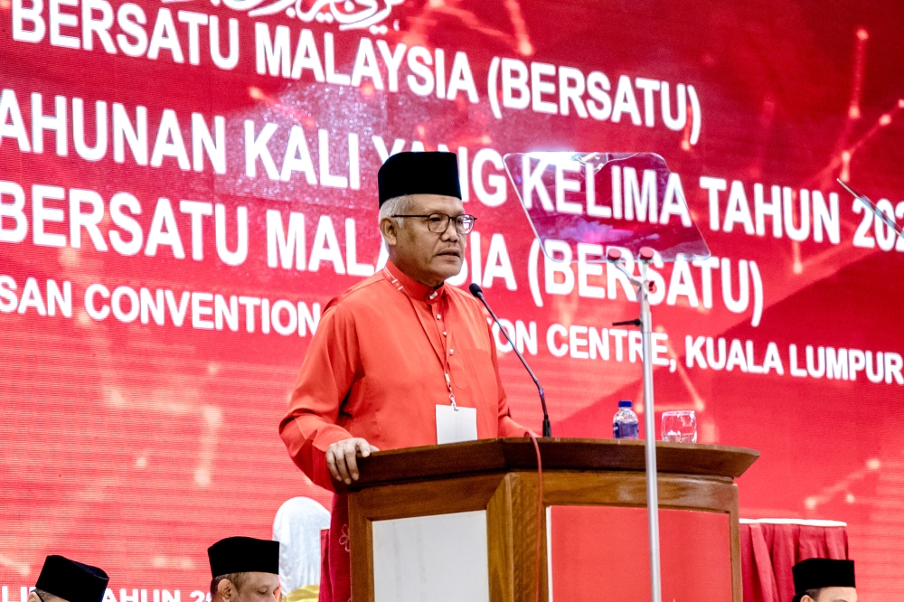 Bersatu secretary-general Datuk Seri Hamzah Zainudin speaks at the Bersatu annual grand meeting (AGM) at Menara PGRM in Kuala Lumpur March 12, 2023. —  Picture by Firdaus Latif