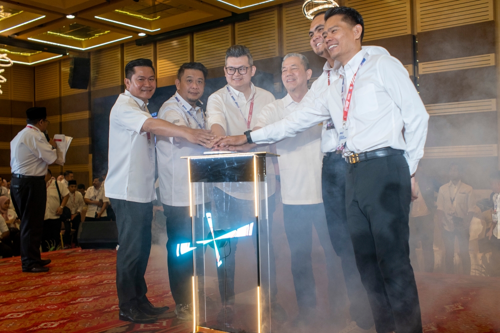 Deputy Prime Minister Datuk Seri Fadillah Yusof (4th left) and other youth leaders officiate the launch of the Unity Government National Youth Convention at World Trade Centre in Kuala Lumpur May 14, 2023. — Picture by Shafwan Zaidon