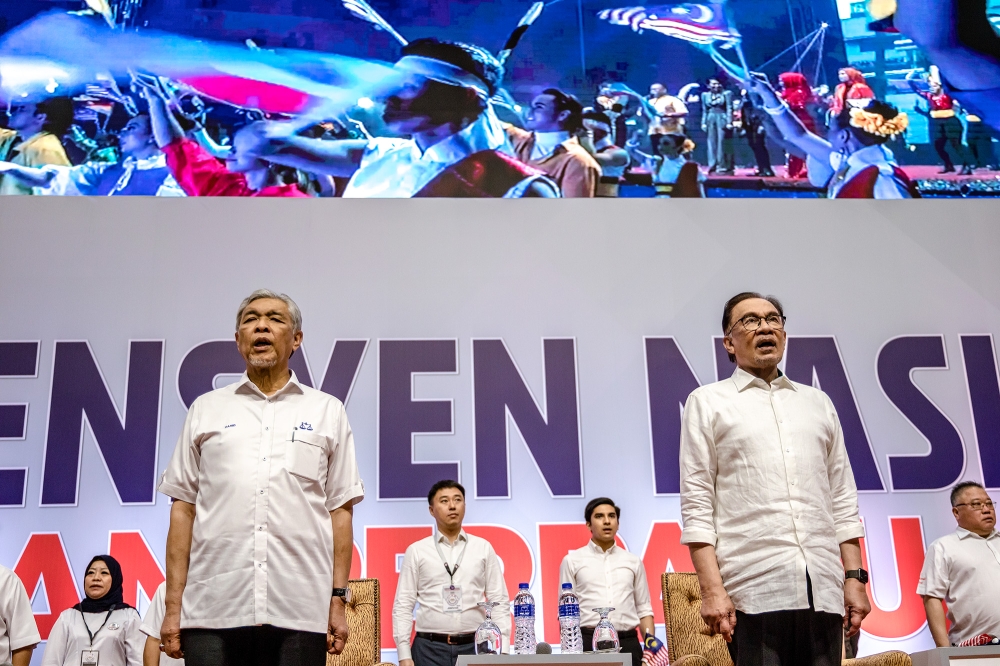 Prime Minister Datuk Seri Anwar Ibrahim and Barisan Nasional chairman Datuk Seri Ahmad Zahid Hamidi are seen during the Unity Government National Convention at World Trade Centre Kuala Lumpur May 14, 2023. — Picture by Firdaus Latif