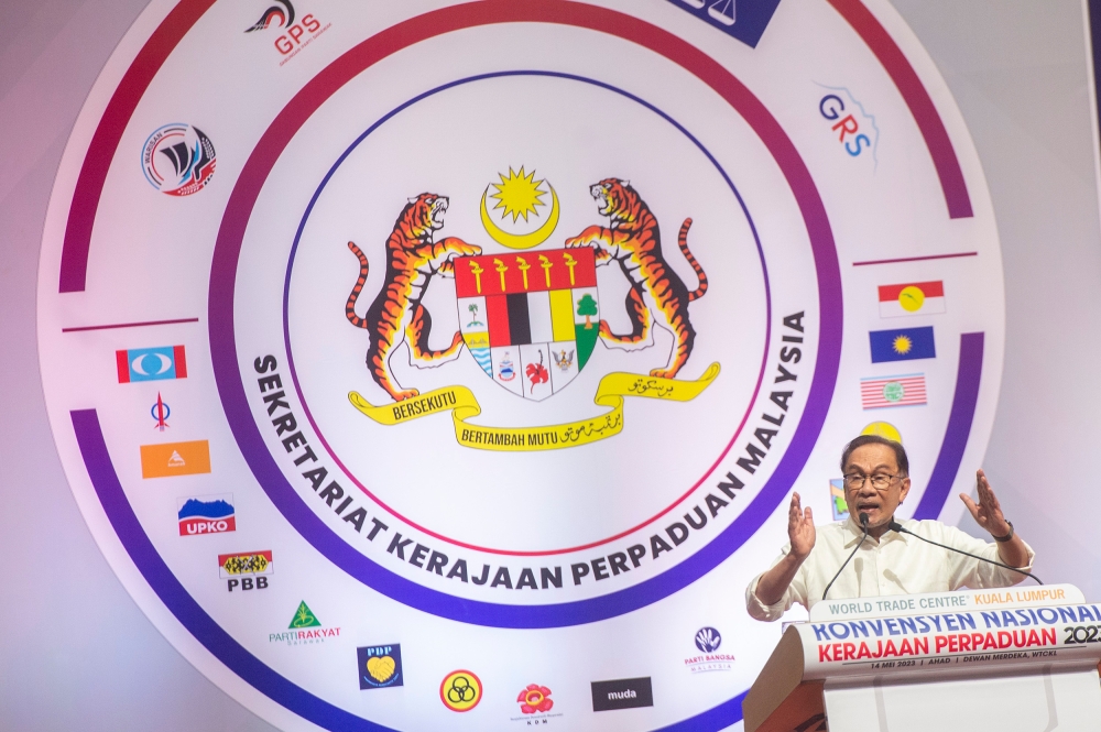 Pakatan Harapan chairman, Datuk Seri Anwar Ibrahim delivers his speech during the Unity Government National Convention at World Trade Centre Kuala Lumpur May 14, 2023. — Picture by Shafwan Zaidon