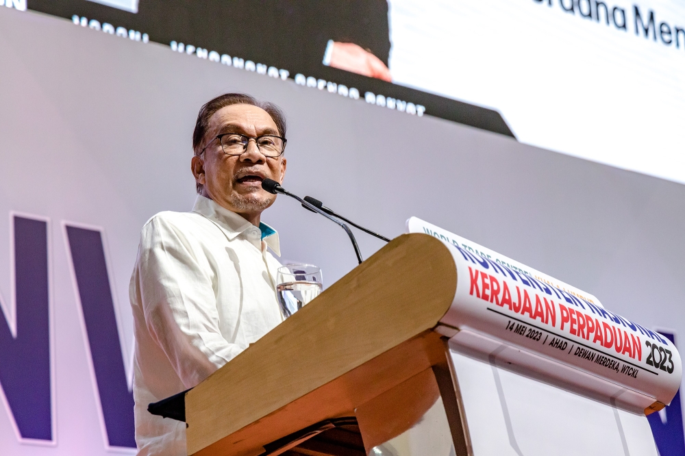 Pakatan Harapan chairman Datuk Seri Anwar Ibrahim delivers his speech during the Unity Government National Convention at World Trade Centre Kuala Lumpur May 14, 2023. — Picture by Firdaus Latif 