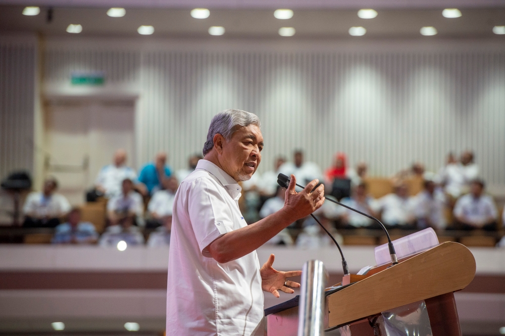 Barisan Nasional chairman Datuk Seri Ahmad Zahid Hamidi delivers his speech during the Unity Government National Convention at World Trade Centre Kuala Lumpur May 14, 2023. — Picture by Shafwan Zaidon