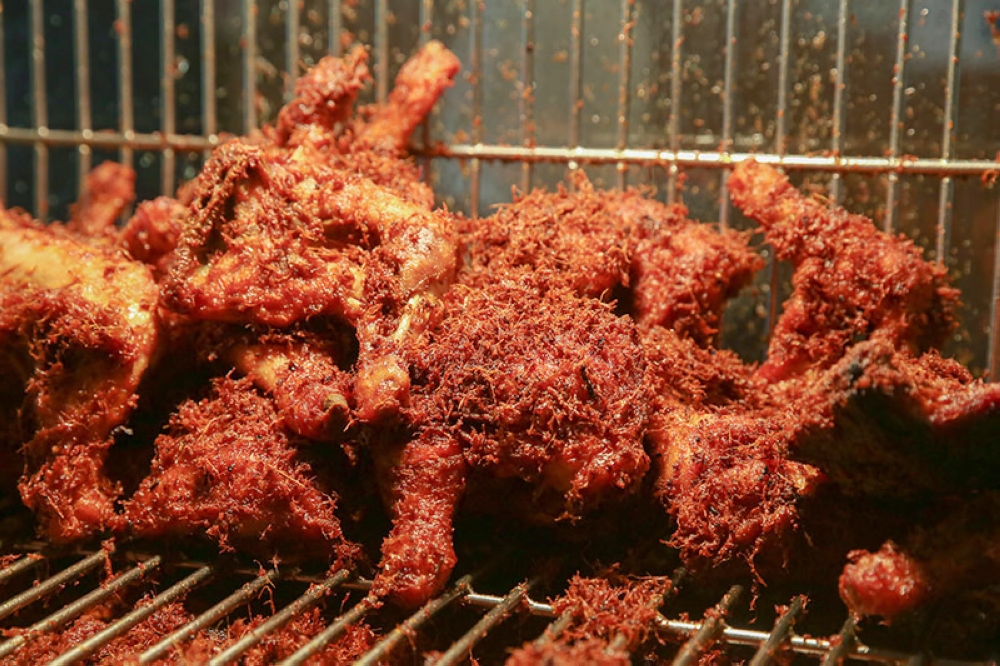 'Ayam goreng berempah' is a must for its juicy meat and the crunchy lemongrass and ginger shreds