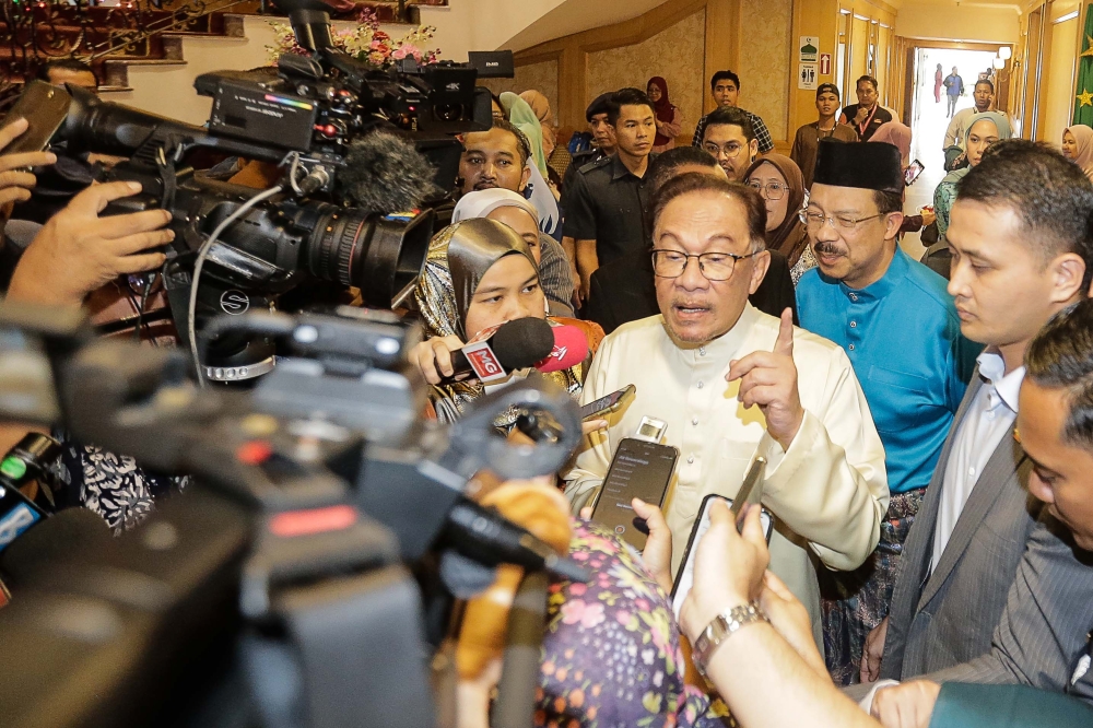 Prime Minister Datuk Seri Anwar Ibrahim speaks to reporters at a Hari Raya Aidilfitri celebration organised by the Prime Minister’s Department in Putrajaya May 17, 2023. — Picture by Sayuti Zainudin