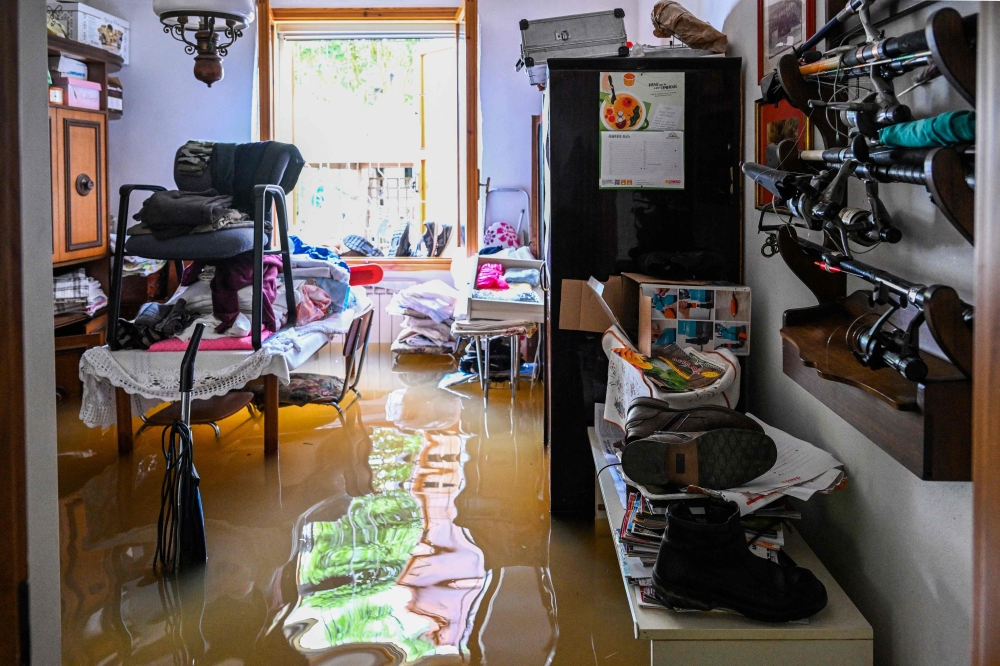 More than 36,000 people have now been forced from their homes by deadly floods in northeast Italy, regional officials said Saturday, as rising waters swallowed more houses and fresh landslides isolated hamlets. — AFP pic