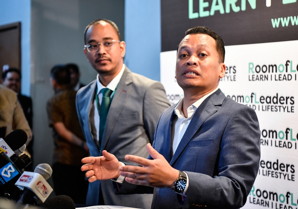 Natural Resources, Environment, and Climate Change Minister Nik Nazmi Nik Ahmad (right) speaks during the Asean Green Hydrogen Conference 2023 in Kuala Lumpur May 23, 2023. Also present Managing Director Room Of Leaders Syed Hafiz Syed Alwi. — Bernama pic