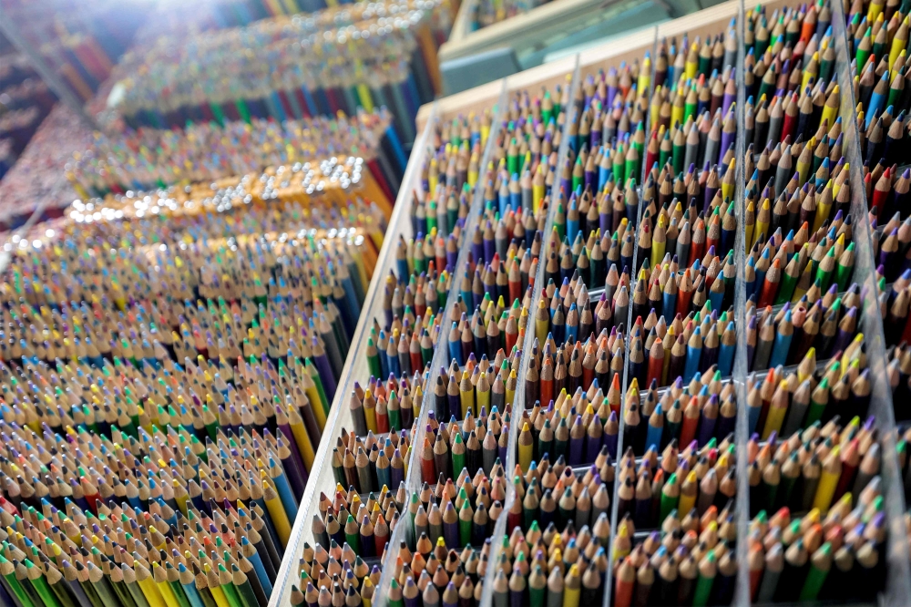 Mohammad Rafi is surrounded by all colours of the rainbow in his tiny shop that sells nothing but art pencils. — AFP pic 