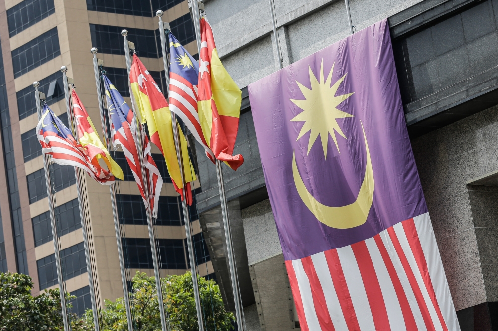 Jalur Gemilang and Selangor flags are seen in Shah Alam. While the analysts saw Penang as safe, they said PH and its partners in the national unity government could not take Selangor and Negeri Sembilan for granted, despite controlling a supermajority in the first and all the seats in the second. — Picture by Sayuti Zainudin