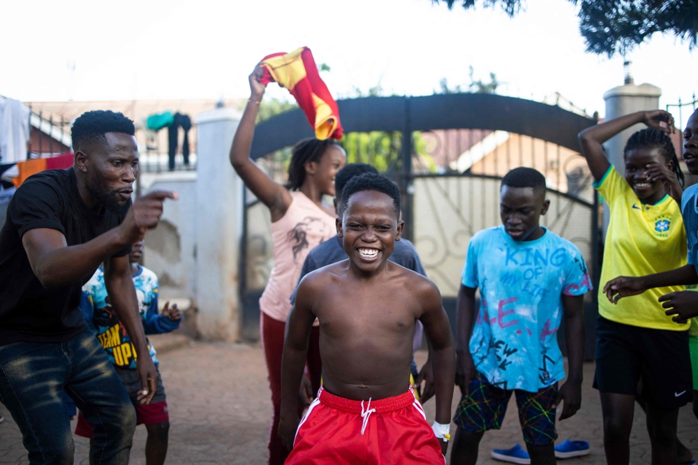 Akram Muyanja (centre), 13, a member of the Ugandan dance group ‘The Ghetto Kids’. — AFP pic 