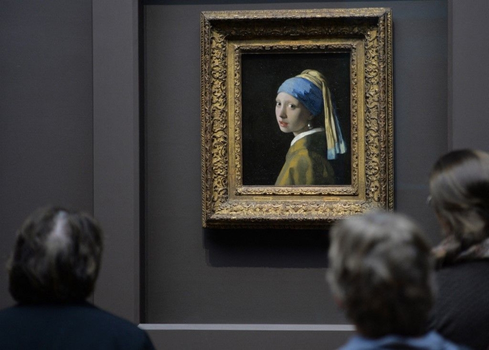 ‘Girl with a Pearl Earring’ by Johannes Vermeer on display at the Rijksmuseum in Amsterdam as part of the “Vermeer” exhibition. — AFP pic