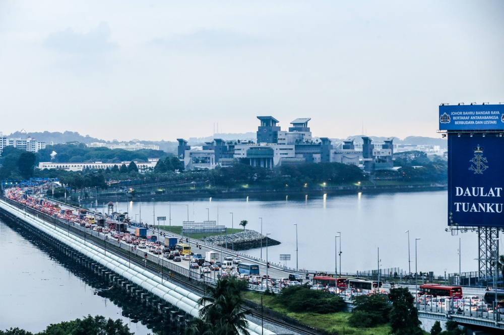 Both Johor and Singapore share two land border crossings — the Johor Causeway in the city here and the Second Link crossing in Gelang Patah. It is considered the most frequently crossed border in the world with more than 300,000 on both crossings per day related to work, business transactions, family reunions, tourism, or simply shopping. — Picture by Hari Anggara