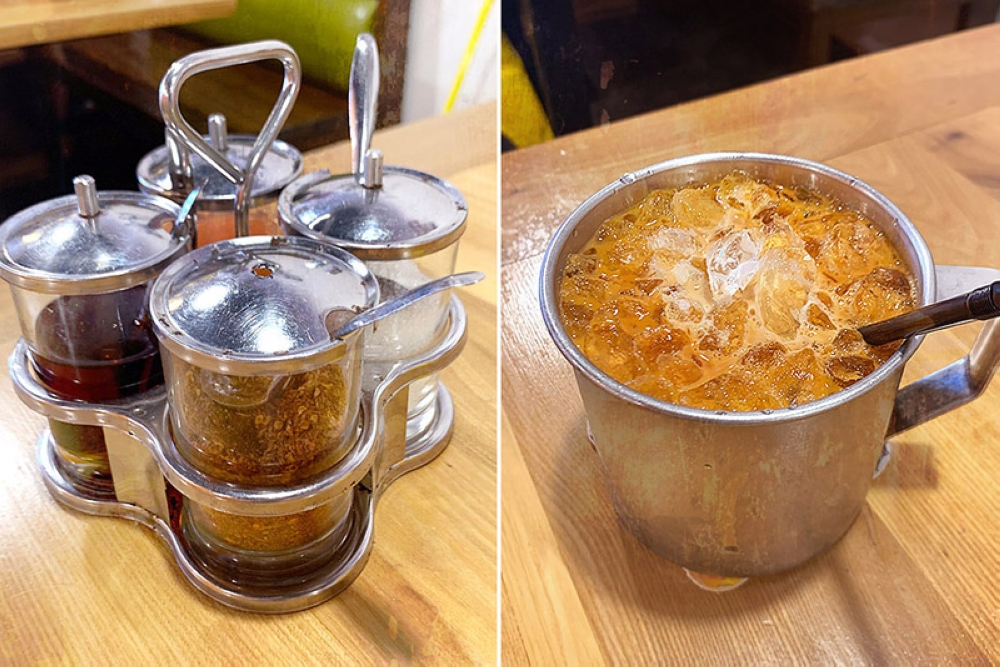 'Puang prik' or condiment caddy (left). Cha yen or Thai iced milk tea.