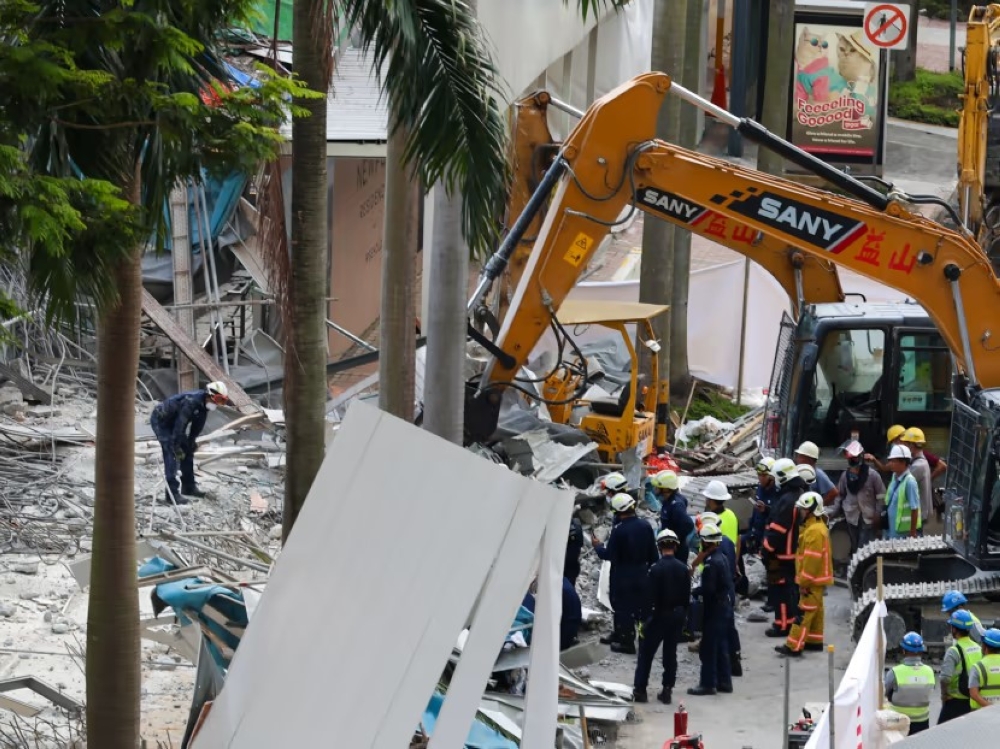 Singapore Civil Defence Force officers at the scene of the incident. — TODAY pic