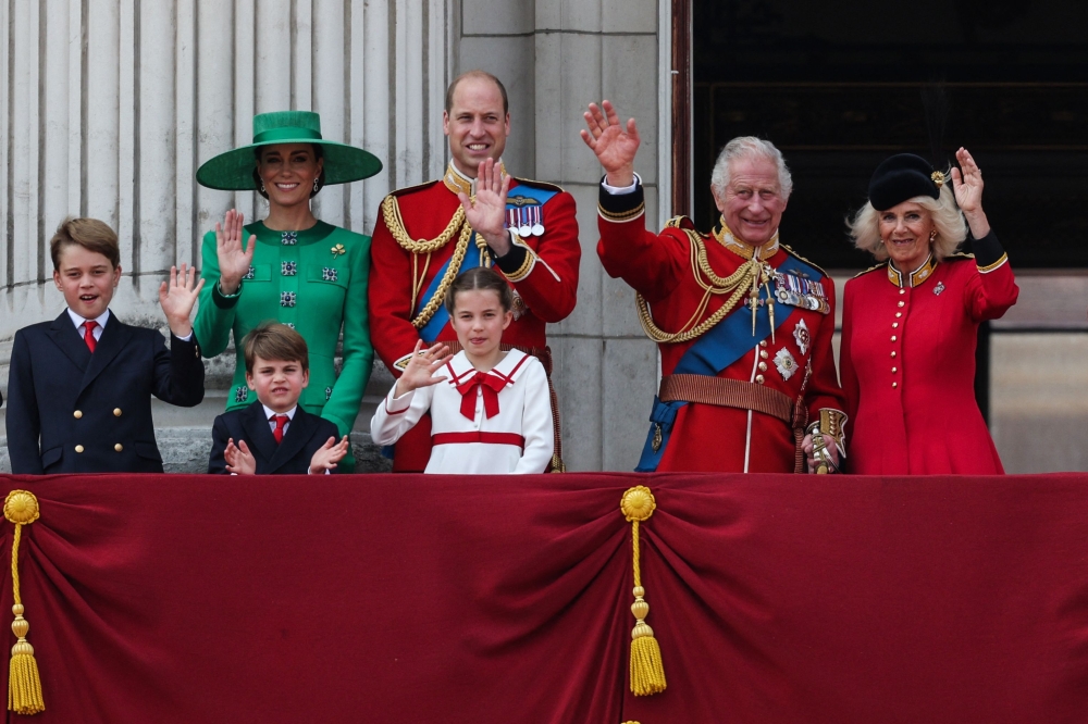 (from left) Prince George of Wales, Catherine, Princess of Wales, Prince Louis of Wales, Prince William, Prince of Wales, Princess Charlotte of Wales, King Charles III and Queen Camilla wave from the balcony of Buckingham Palace after attending the King's Birthday Parade, 'Trooping the Colour', in London on June 17, 2023. — AFP pic