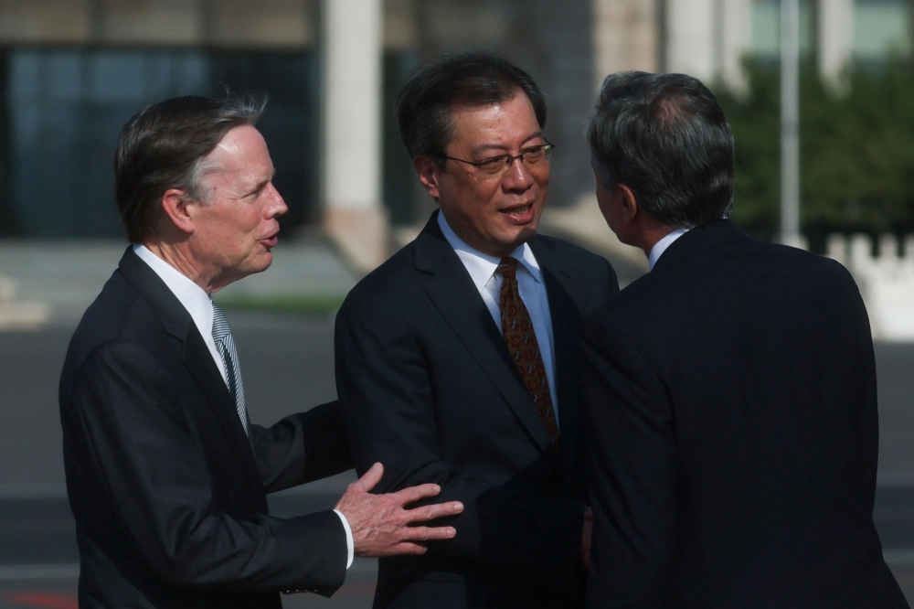 US Secretary of State Antony Blinken (right) is welcomed by Director General of the Department of North American and Oceanian Affairs of the Foreign Ministry Yang Tao and US Ambassador to China Nicholas Burns (left), as he arrives in Bejing, China, June 18, 2023. — AFP pic