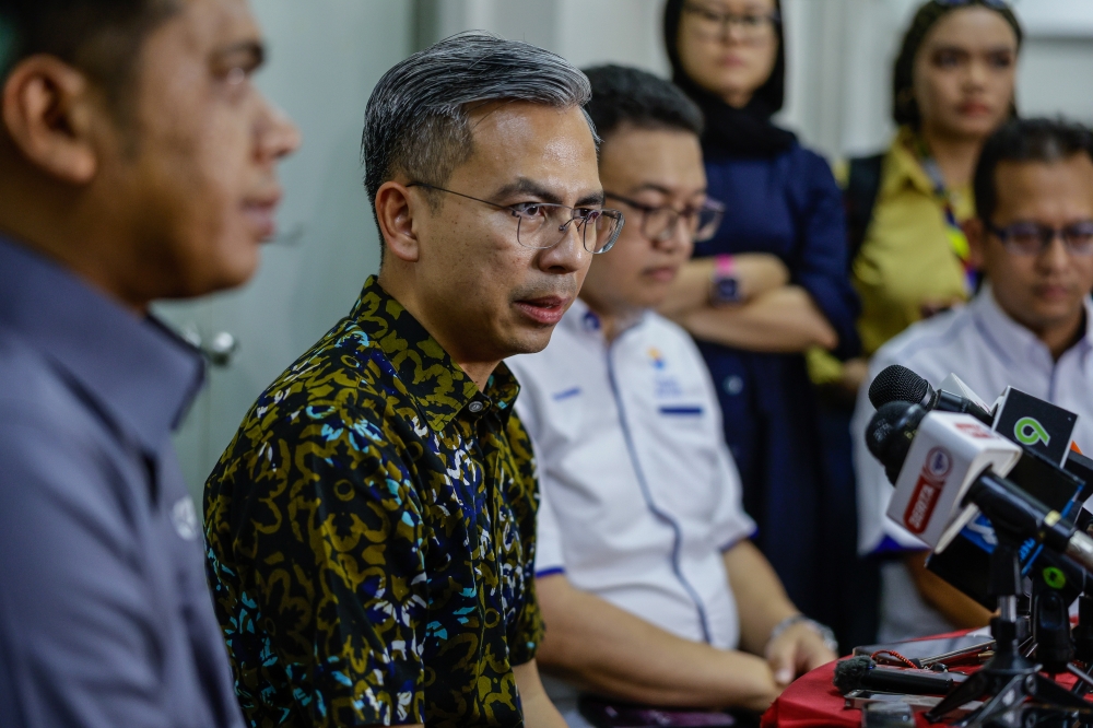 Communications and Digital Minister Fahmi Fadzil speaks during a media conference after attending the closing ceremony of the Cyber Security, Digital Economy and Connectivity awareness campaign at Pantai Permai Housing Project in Kuala Lumpur June 18, 2023. — Bernama pic