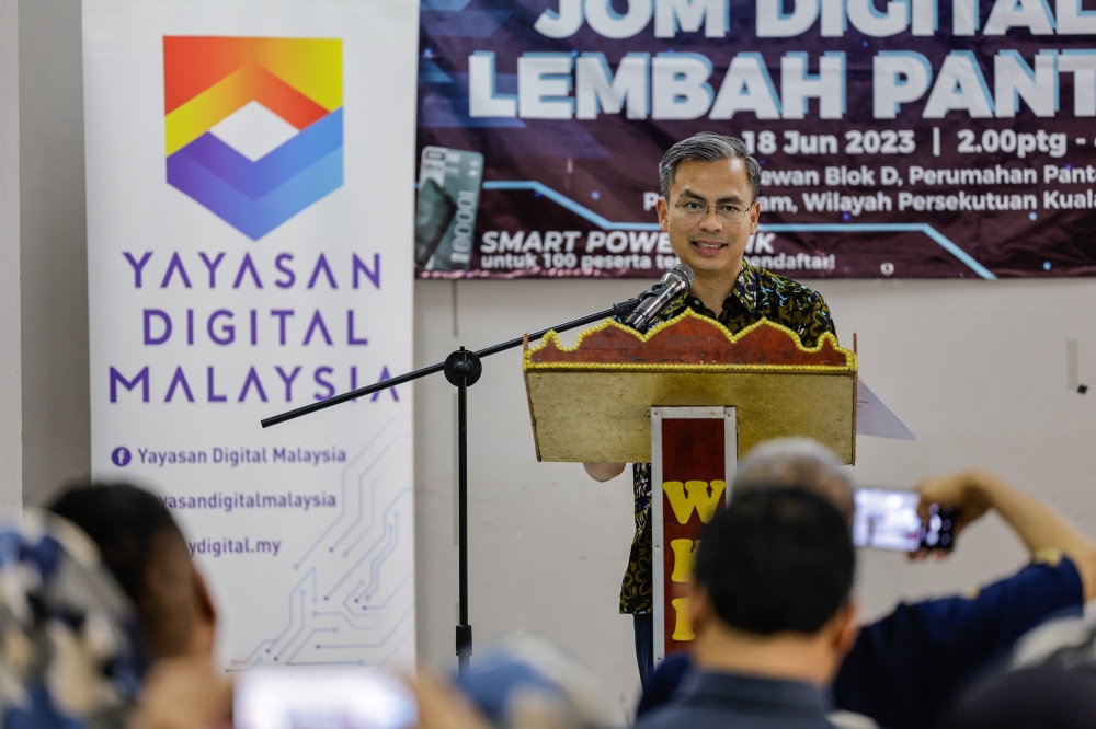 Communications and Digital Minister Fahmi Fadzil speaks during a media conference after attending the closing ceremony of the Cyber Security, Digital Economy and Connectivity awareness campaign at Pantai Permai Housing Project in Kuala Lumpur June 18, 2023. — Bernama pic