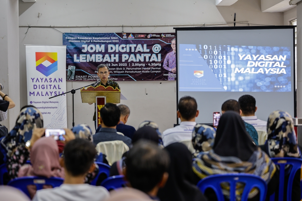 Communications and Digital Minister Fahmi Fadzil speaks during a media conference after attending the closing ceremony of the Cyber Security, Digital Economy and Connectivity awareness campaign at Pantai Permai Housing Project in Kuala Lumpur June 18, 2023. — Bernama pic