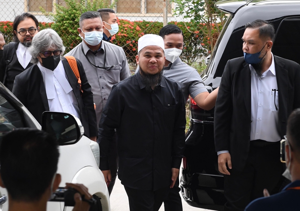 File picture of reacher Ebit Lew arriving at the Tenom Magistrates’ Court in Sabah, September 27, 2022. — Bernama pic