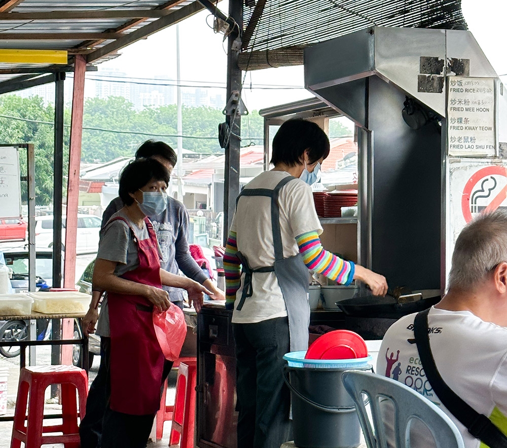 Look for the 'char kway teow' stall run by these three sisters.