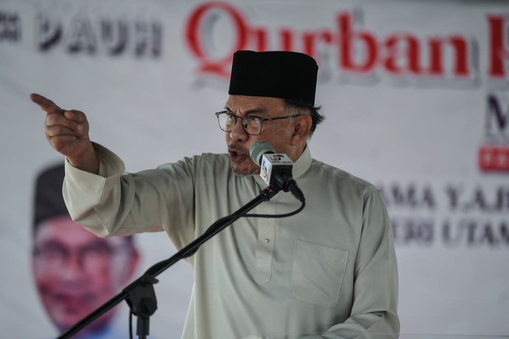 Prime Minister Datuk Seri Anwar Ibrahim delivers a speech during the Qurban Perdana Madani event in Permatang Pauh, June 30, 2023. — Bernama pic  