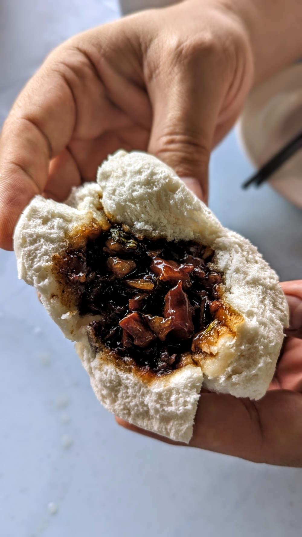 Like a blooming flower revealing its nectar, this 'Char Siew Bao' is filled with deliciousness.