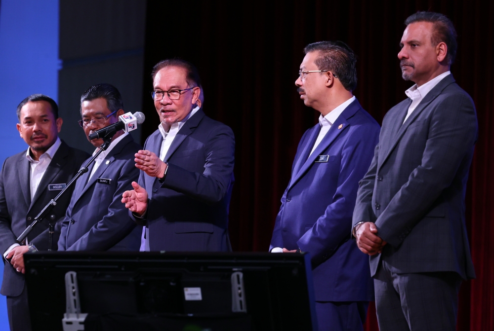 Prime Minister Datuk Seri Anwar Ibrahim (centre) speaks during a meeting with staff of the Prime Minister’s Department, in Putrajaya July 3, 2023. — Picture via Twitter/Bernamadotcom