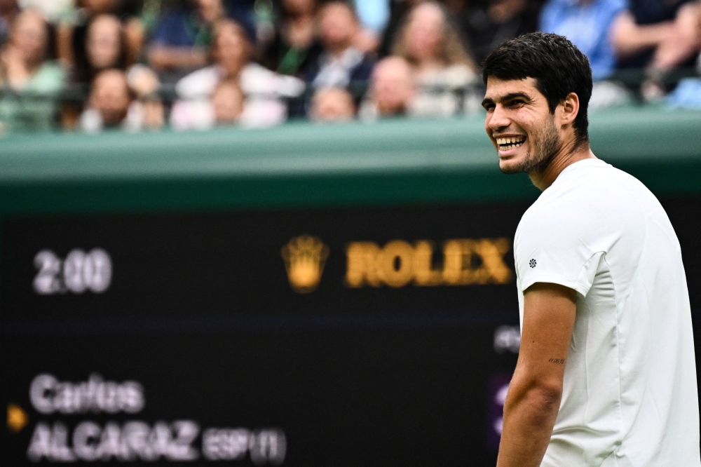 Spain’s Carlos Alcaraz reacts as he plays against France’s Jeremy Chardy during their men’s singles tennis match on the second day of the 2023 Wimbledon Championships at The All England Tennis Club in Wimbledon, southwest London July 4, 2023. ¬— AFP pic