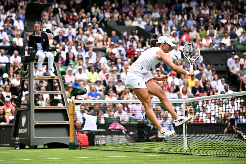 Poland’s Iga Swiatek in action during her second round match against Spain’s Sara Sorribes Tormo at the All England Lawn Tennis and Croquet Club, London, Britain, July 5, 2023. — Reuters pic 