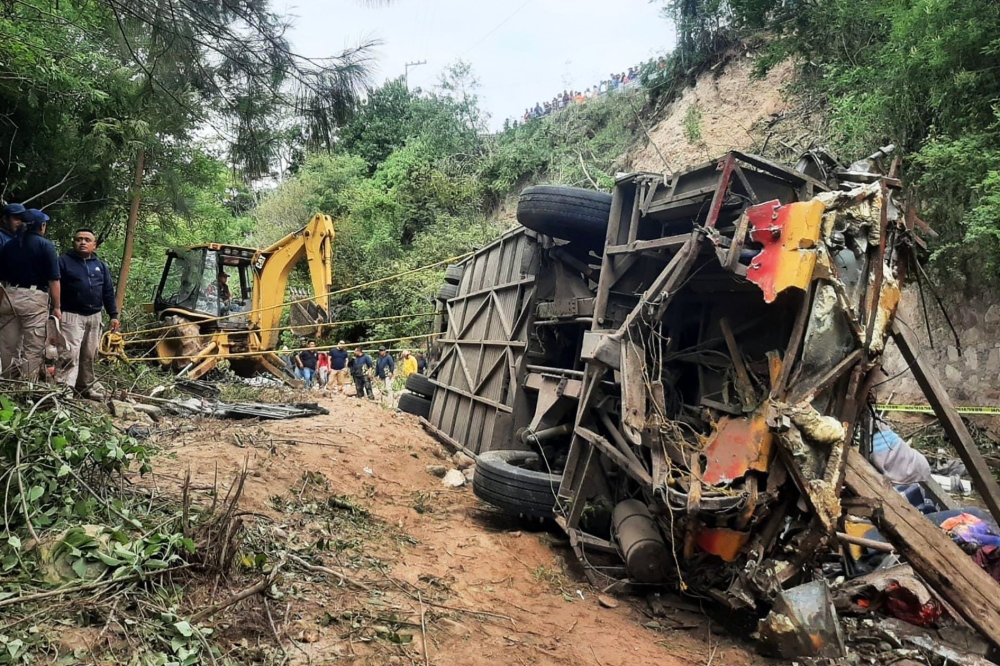 At least 27 people were killed in Mexico when a passenger bus careened off a mountain road and plummeted into a ravine yesterday in the southern state of Oaxaca, police said. — AFP pic/Tlaxiaco Municipal Police