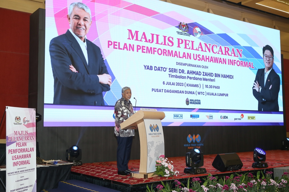 Deputy Prime Minister Datuk Seri Ahmad Zahid Hamidi delivers his speech during the launch of the Formalising the Informal Entrepreneurs Plan ceremony at World Trade Centre in Kuala Lumpur July 6, 2023. — Picture by Yusof Mat Isa